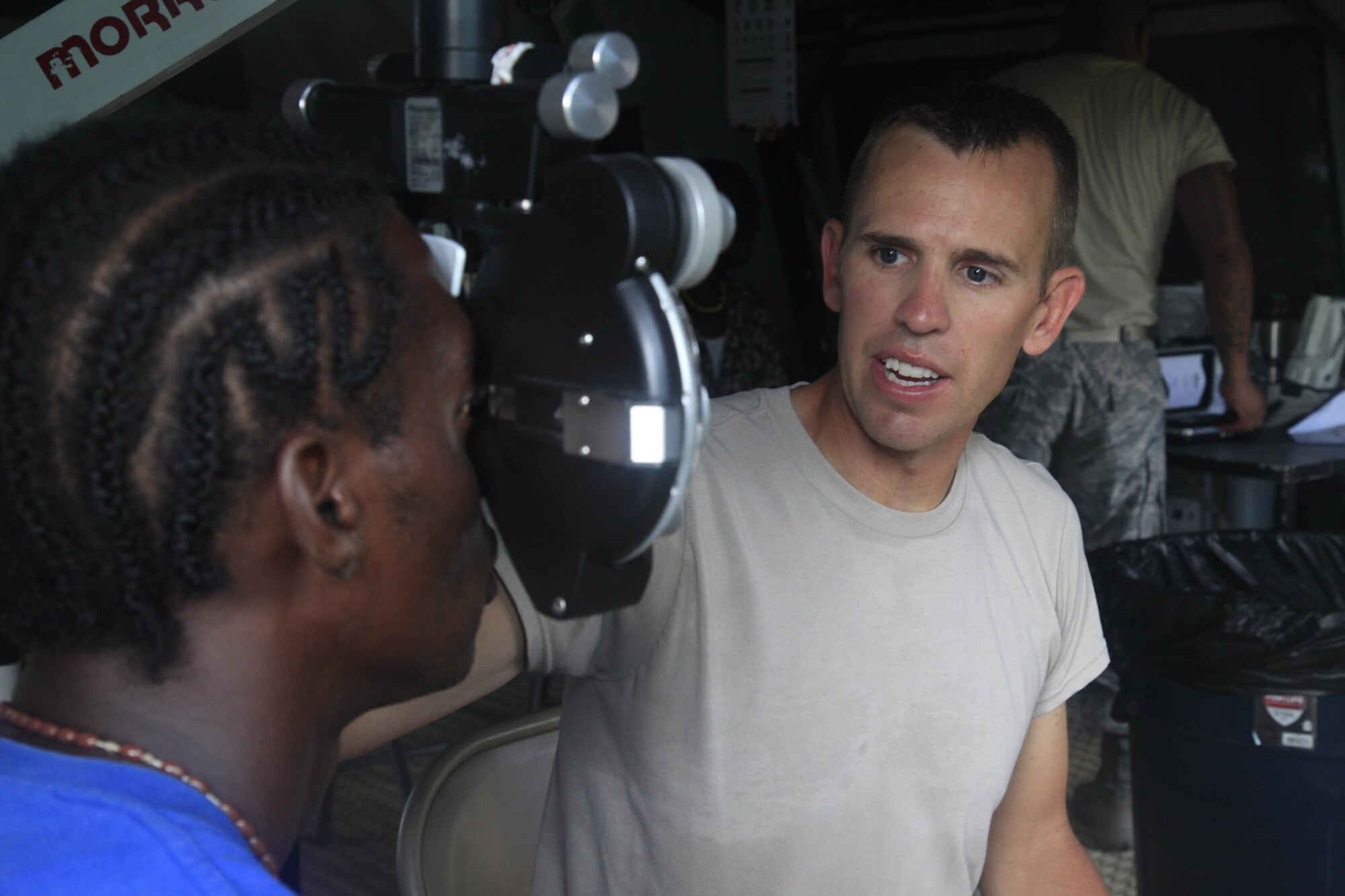 U.S. Air Force Capt. David Edmund, 96th Medical Group, examines a patient's eye for prescription glasses at a medical readiness event in Dangriga, Belize, May 22, 2017. This is the third and final medical event scheduled for Beyond the Horizon 2017, a U.S. Southern Command-sponsored, Army South-led exercise designed to provide humanitarian and engineering services to communities in need, demonstrating U.S. support for Belize. (U.S. Army photo by Spc. Kelson Brooks)