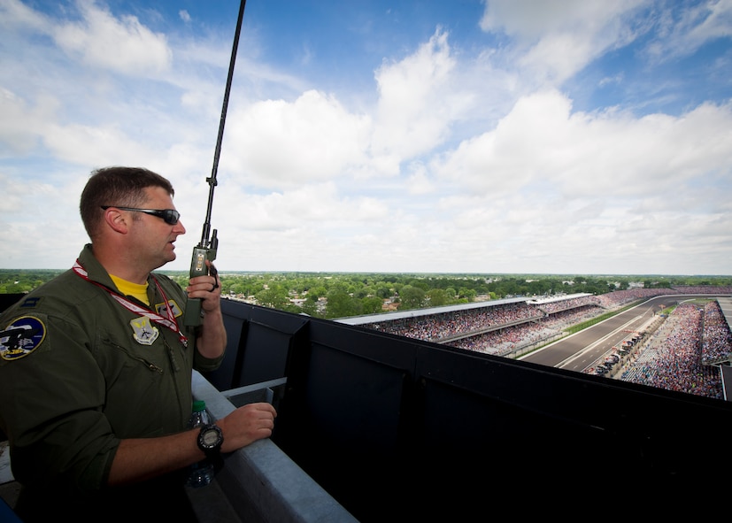 Capt. Micah McCracken, 69th Bomb Squadron B-52 instructor pilot, checks in with the aircrew via radio before they fly over the Indianapolis Motor Speedway, Indianapolis, Ind., May 28, 2017. The aircraft from Minot Air Force Base, N.D., passed over the speedway as the National Anthem played, kicking-off the Indianapolis 500 race. (U.S. Air Force photo/Senior Airman Sahara L. Fales)