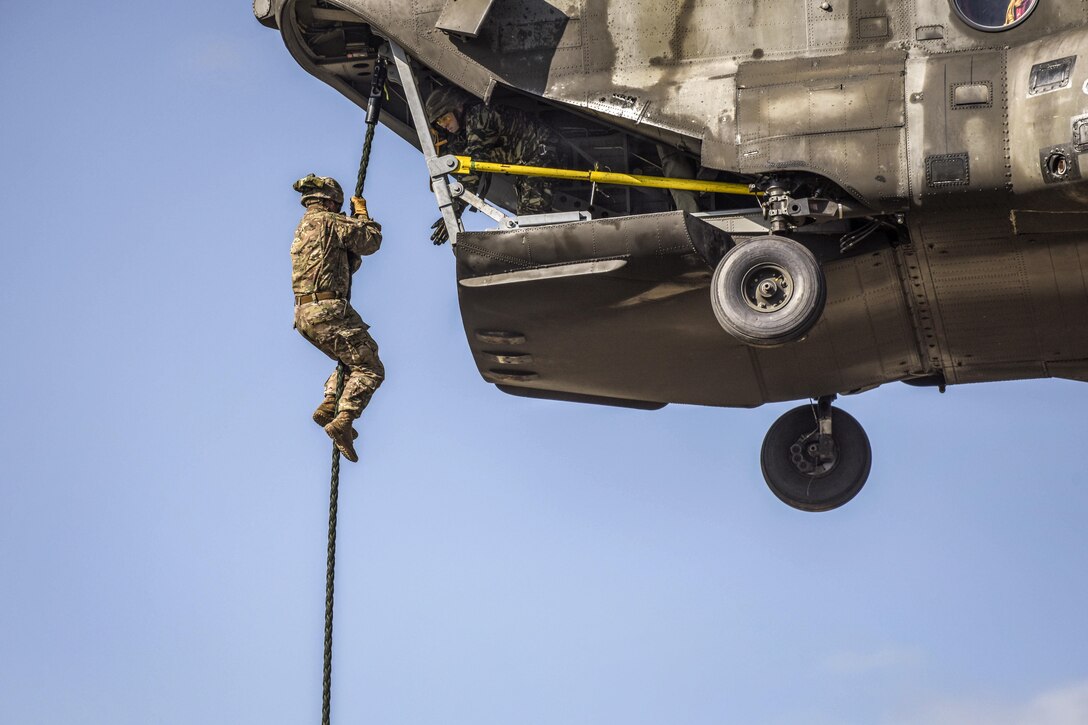 A soldier conducts fast-rope training from a Greek helicopter as a part of Exercise Bayonet Minotaur 2017 in Thessaloniki, Greece, May 22, 2017. The exercise aimed to enhance NATO operational standards between U.S. and Greek armed forces. Army photo by Staff Sgt. Philip Steiner