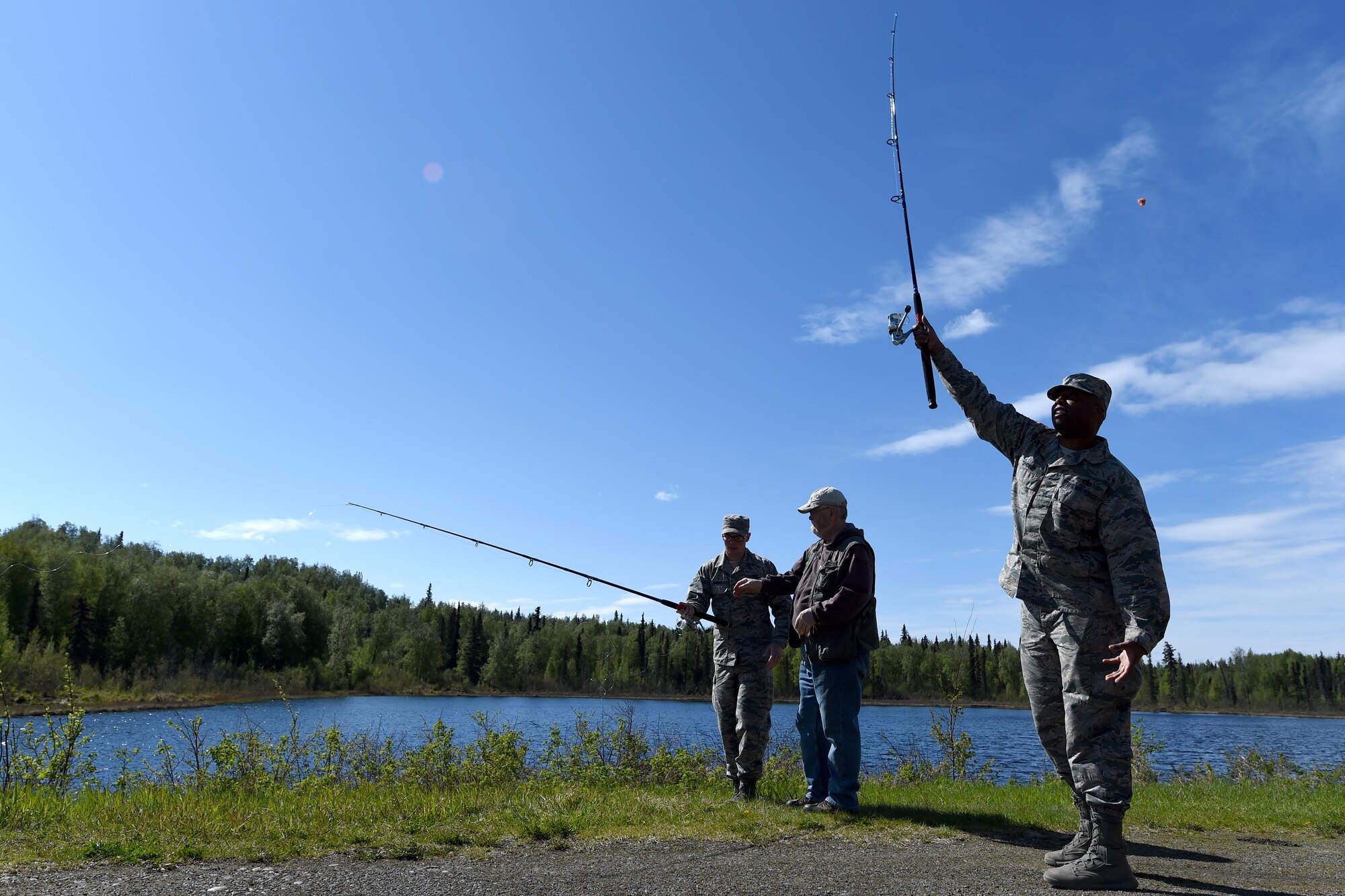 U.S. Air Force Staff Sgt. Daniel Shobe, 773d Logistics Readiness Squadron non-commissioned officer in charge of training and validation, casts his line during Safety Day at the Hillberg stables at Joint Base Elmendorf-Richardson, Alaska, May 25, 2017. Field experts on all-terrain vehicles, kayaking, hiking, mountain biking, archery, and fly fishing provided hands-on demonstrations and briefings for Safety Day.