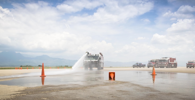 The Commander of the 612th Air Base Squadron practices accurately spraying down cones at Joint Task Force-Bravo, May 12th, 2017. The Commander of the 612th ABS participates in a 24-hour shift to understand the training requirements and operational stress to be a firefighter. (U.S. Air Force photo by Senior Airman Julie Kae/released)