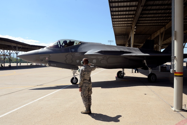Airman 1st Class Michael Wilkins, a crew chief assigned to the 34th Aircraft Maintenance Unit, launches an F-35 Lightning II aircraft, number 5079, at Hill Air Force Base, Utah, May 22. In addition to the sortie being the 3,000th in an operational F-35 at Hill, it also turned out to be Wilkens’s first solo launch. (U.S. Air Force/Todd Cromar)