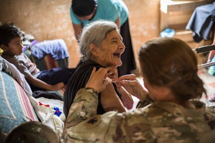 U.S. Army Lt. Col. Rhonda Dyer, Joint Task Force - Bravo, gives a vaccine to a local Honduran while out on a Community Health Nurse mission in Comayagua, Honduras, May 10, 2017. The CHM is a weekly partnership with the staff at Jose Ochoa Public Health Clinic, administering vaccines, Vitamins, deworming medication and other medical supplies to over 180 Hondurans around the Comayagua area on May 10, 2017.  (U.S. Air National Guard photo by Master Sgt. Scott Thompson/released)