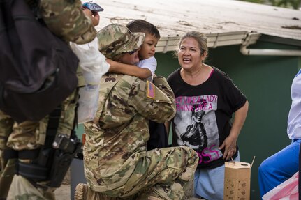 U.S. Army Lt. Col. Rhonda Dyer, Joint Task Force - Bravo, gets a hug from a local Honduran child while out on a Community Health Nurse mission in Comayagua, Honduras, May 10, 2017. The CHM is a weekly partnership with the staff at Jose Ochoa Public Health Clinic, administering vaccines, Vitamins, deworming medication and other medical supplies to over 180 Hondurans around the Comayagua area on May 10, 2017.  (U.S. Air National Guard photo by Master Sgt. Scott Thompson/released)