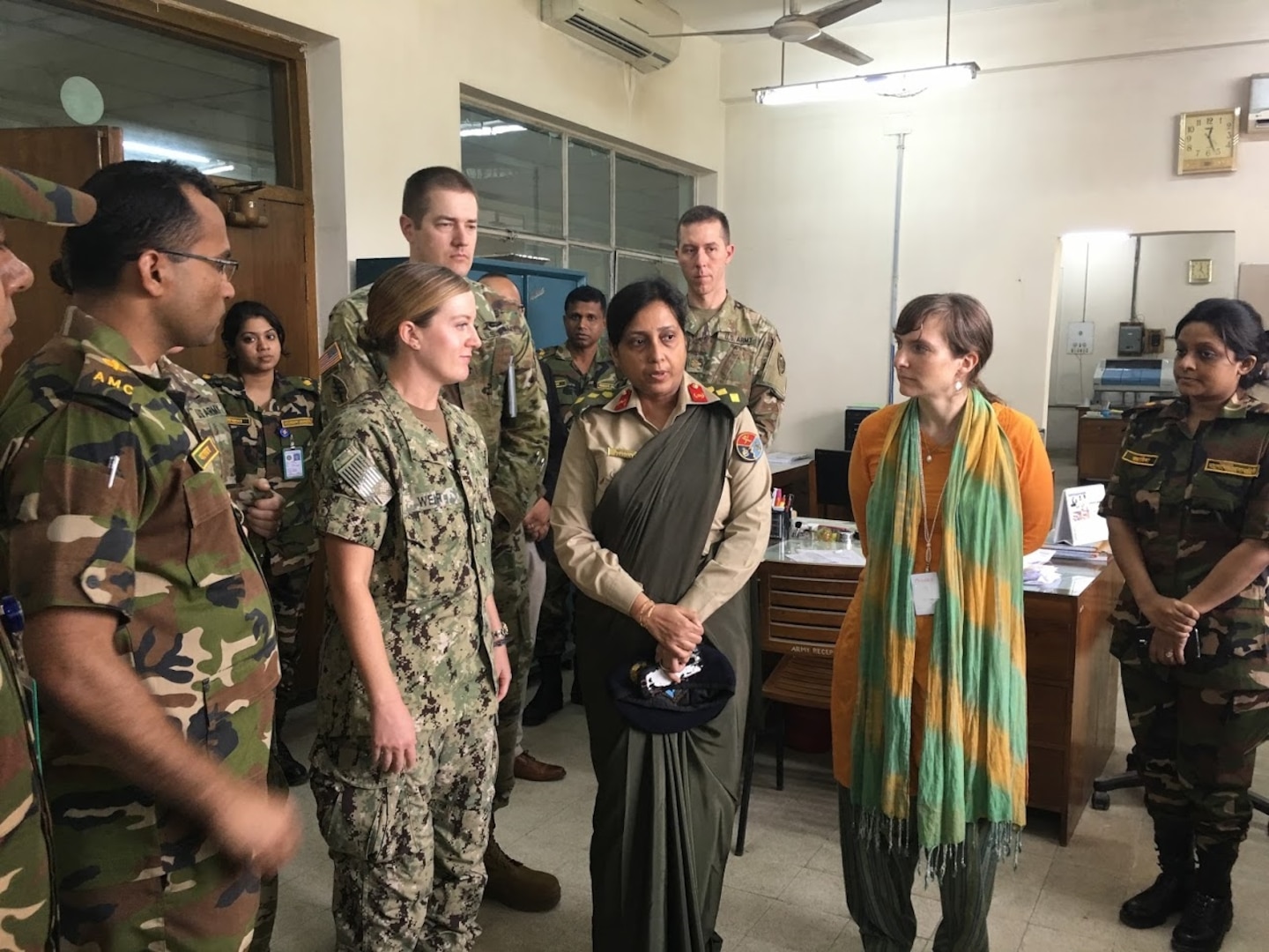 Lt. Dawn Weir (center left), microbiologist, Navy Environmental and Preventive Medicine Unit-Six discuss the upcoming laboratory biosafety and sample handling, emergency response protocols, and military and civilian coordination subject matter expertise exchange with Bangladesh's Armed Forces Institute of Pathology's Chief Virologist and Stephanie Doan (center right), Acting Director for Bangladesh, U.S. Center for Disease Control and Prevention. 