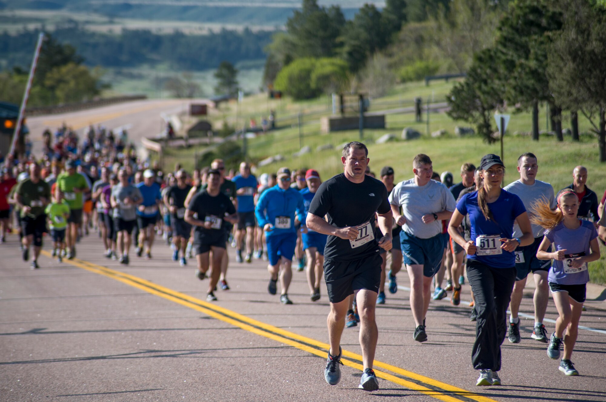 CHEYENNE MOUNTAIN AIR FORCE STATION, Colo. – Runners participating in the Memorial Day 5k Tunnel Run race up the front of the mountain at Cheyenne Mountain Air Force Station, Colo., May 25, 2017. Runners were comprised of military contractors, retirees, active-duty service members and dependents. (U.S. Air Force photo by Airman 1st Class Dennis Hoffman)