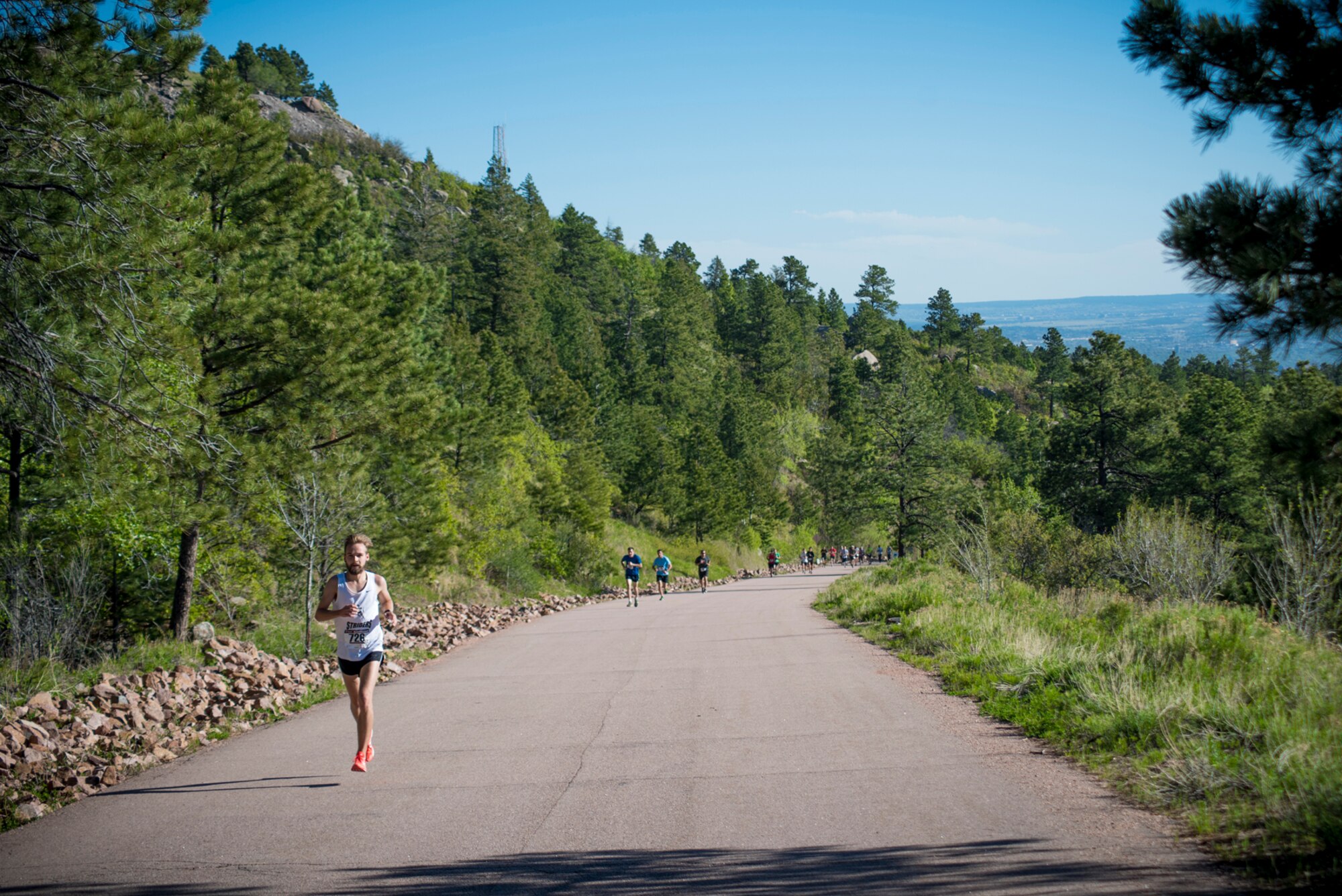 CHEYENNE MOUNTAIN AIR FORCE STATION, Colo. – Runners participating in the Memorial Day 5k Tunnel Run race through winding roads leading to the southern portal of Cheyenne Mountain Air Force Station, Colo., May 25, 2017. The first runner to cross the finish line completed the 5k race in 19 minutes and 9 seconds. (U.S. Air Force photo by Airman 1st Class Dennis Hoffman)