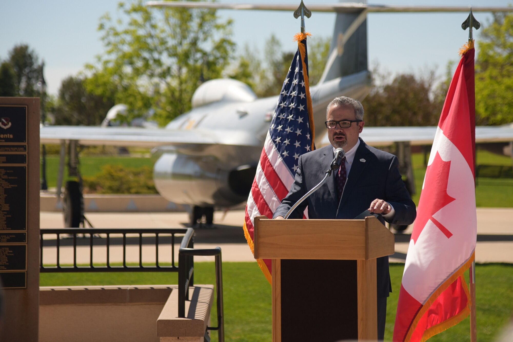 PETERSON AIR FORCE BASE, Colo.- Jeff Greene, Colorado Springs Mayor’s chief of staff, speaks at the 21st Space Wing’s 25th Anniversary Commemorative Event at the Peterson Air and Space Museum, May 25, 2017, at Peterson Air Force Base, Colo. During the event, Greene and Col. Doug Schiess, 21st SW commander, unveiled the time capsule that will be sealed after the event and opened on the wing’s 50th anniversary in 2042.  The 21st SW was activated May 15, 1992, under Air Force Space Command. (U.S. Air Force photo by Staff Sgt. Tiffany Lundberg) 