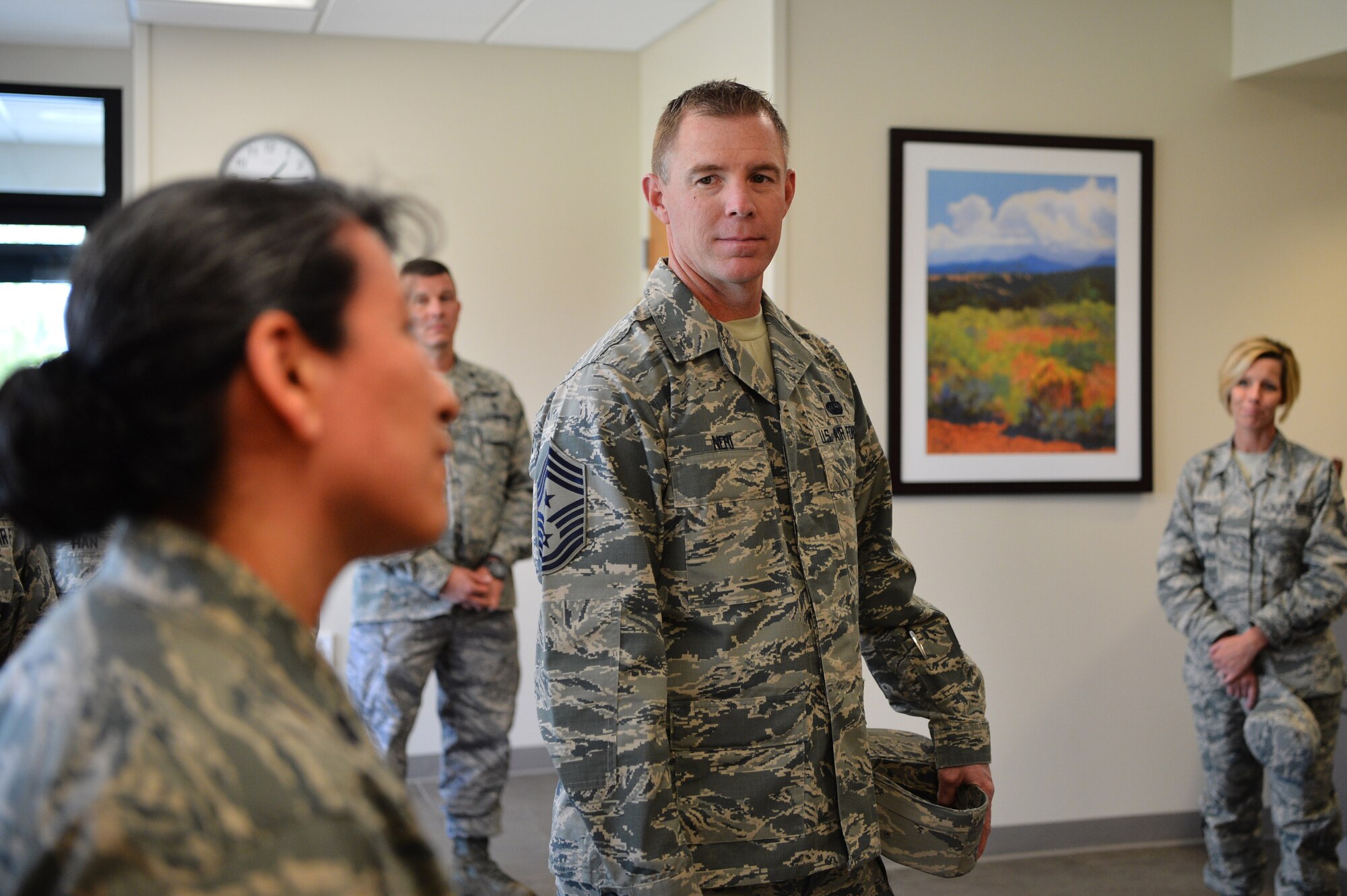 Chief Master Sgt. Craig A. Neri, Command Chief Master Sergeant, 14th Air Force (Air Forces Strategic), Air Force Space Command; and Command Senior Enlisted Leader, Joint Functional Component Command for Space, U.S. Strategic Command, receives a short brief from Lt. Col. Rena Nicholas, 460th Medical Group clinical psychologist, May 24, 2017, on Buckley Air Force Base, Colo. Nicholas broke down recent sleep studies for Neri, ensuring the 460th MDG is taking care of the personnel on base who work long, often-changing shifts. (U.S. Air Force photo by Airman 1st Class Holden S. Faul/ Released)