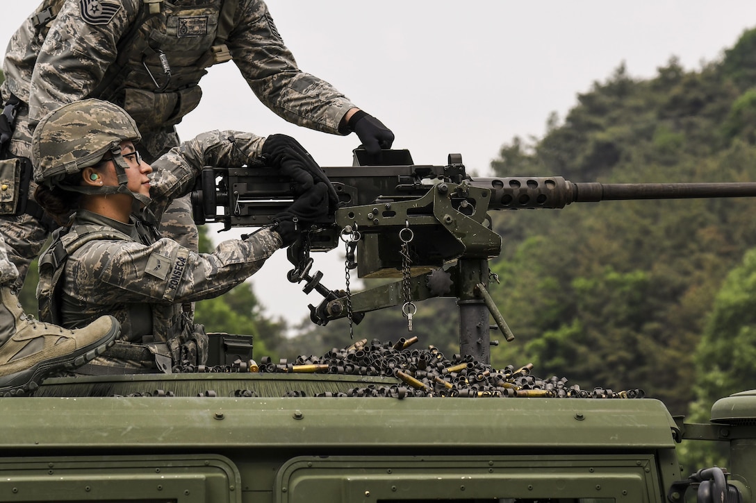 Air Force Airman 1st Class Jocelyn Fonseca charges an M2 machine gun during a weapons qualification training event at Camp Rodriguez, South Korea, May 23, 2017. Fonseca is a defender with the 8th Security Forces Squadron. Air Force photo by Airman 1st Class Gwendalyn Smith