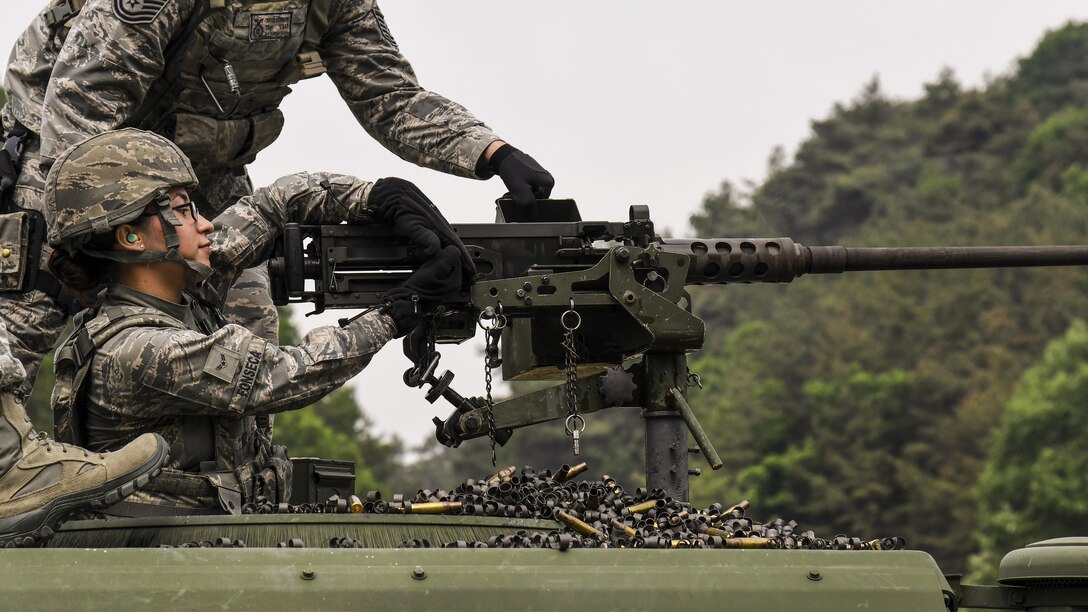 Air Force Airman 1st Class Jocelyn Fonseca charges an M2 machine gun during a weapons qualification training event at Camp Rodriguez, South Korea, May 23, 2017. Fonseca is a defender with the 8th Security Forces Squadron. Air Force photo by Airman 1st Class Gwendalyn Smith