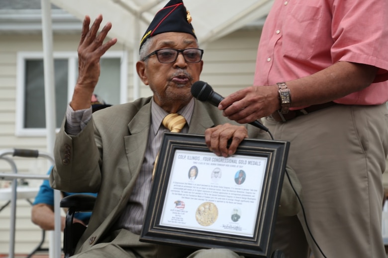Archibald Mosley gives a speech after receiving a Congressional Gold Medal memento for Montford Point Marines, May 27, at the Colp Area Veterans Celebration, Dedication and Remembrance Ceremony, in Colp, Illinois. Nearly 20,000 African-Americans joined the Marine Corps in 1942, after President Franklin D. Roosevelt issued a “presidential directive giving African Americans an opportunity to be recruited in the Marine Corps,” according to the Montford Point Marines Association website. They didn’t receive recruit training at San Diego or Parris Island, however, but Camp Montford Point, N.C., a segregated training site for African American Marine recruits. For the next seven years, the camp remained opened until it became desegregated. The four Marines are Sol Griffin, Jr.; James L. Kirby, Early Taylor, Jr. and Archibald Mosley. These Marines, among many other Montford Point Marines across the country, were awarded the Congressional Gold Medal, the highest award that can be given to a civilian by Congress, in 2012. Mosley is one of four Montford Point Marines from Colp. (U.S. Marine Corps photo by Gunnery Sgt. Bryan A. Peterson) 