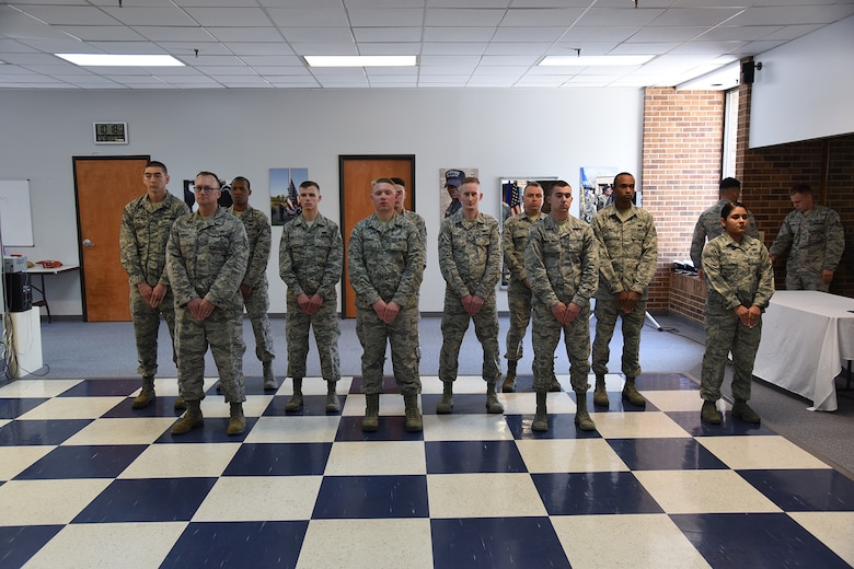 The graduating High Frontier Honor Guard class stands in formation in anticipation of their graduation certificates at Peterson Air Force Base, Colorado, Friday, May 19, 2017. This class completed two weeks of intense training in preparation for their next six months of Honor Guard service. (U.S. Air Force photo/Robert Lingley)