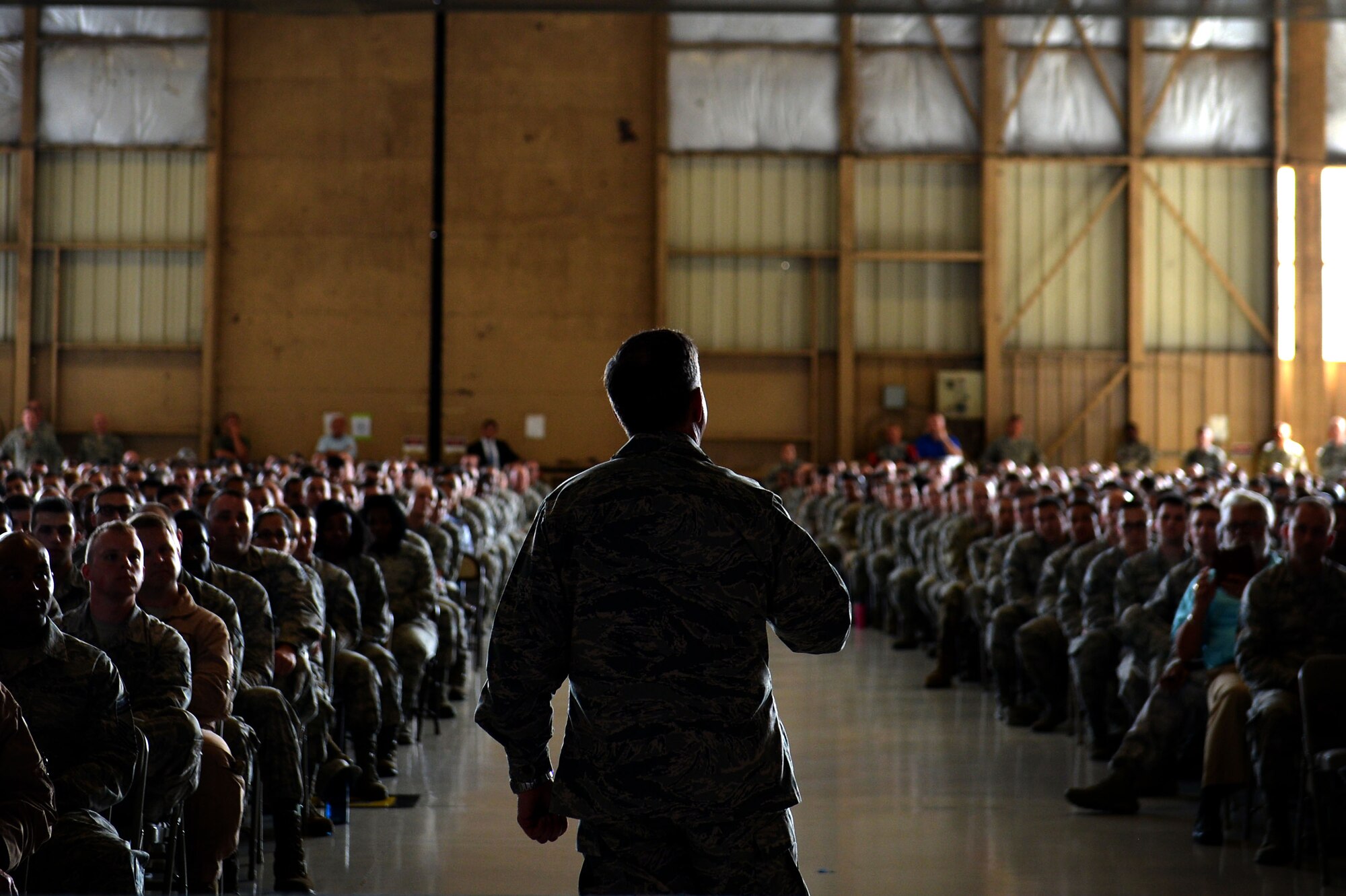 U.S. Airmen assigned to Shaw Air Force Base, S.C., listen as Air Force Chief of Staff Gen. David L. Goldfein speaks about current Air Force operations during an all-call at Shaw Air Force Base, S.C., May 30, 2017. During the all-call Airmen received the opportunity to ask Goldfein questions about the current state of the Air Force and any concerns they had. (U.S. Air Force photo by Airman 1st Class Christopher Maldonado)