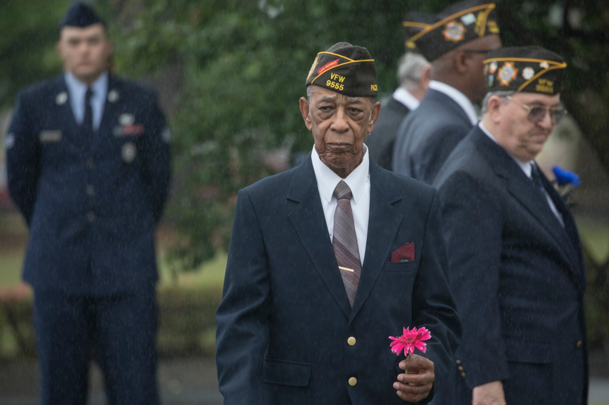 Retired U.S. Air Force Master Sgt. Ernest Richardson, a member of the Veterans of Foreign War Post 9555, holds a flower during the Memorial Day ceremony at Yokota Air Base, Japan, May 26, 2017. The 374th Airlift Wing hosted the ceremony in memory of those who made the ultimate sacrifice during military service. (U.S. Air Force photo by Yasuo Osakabe)