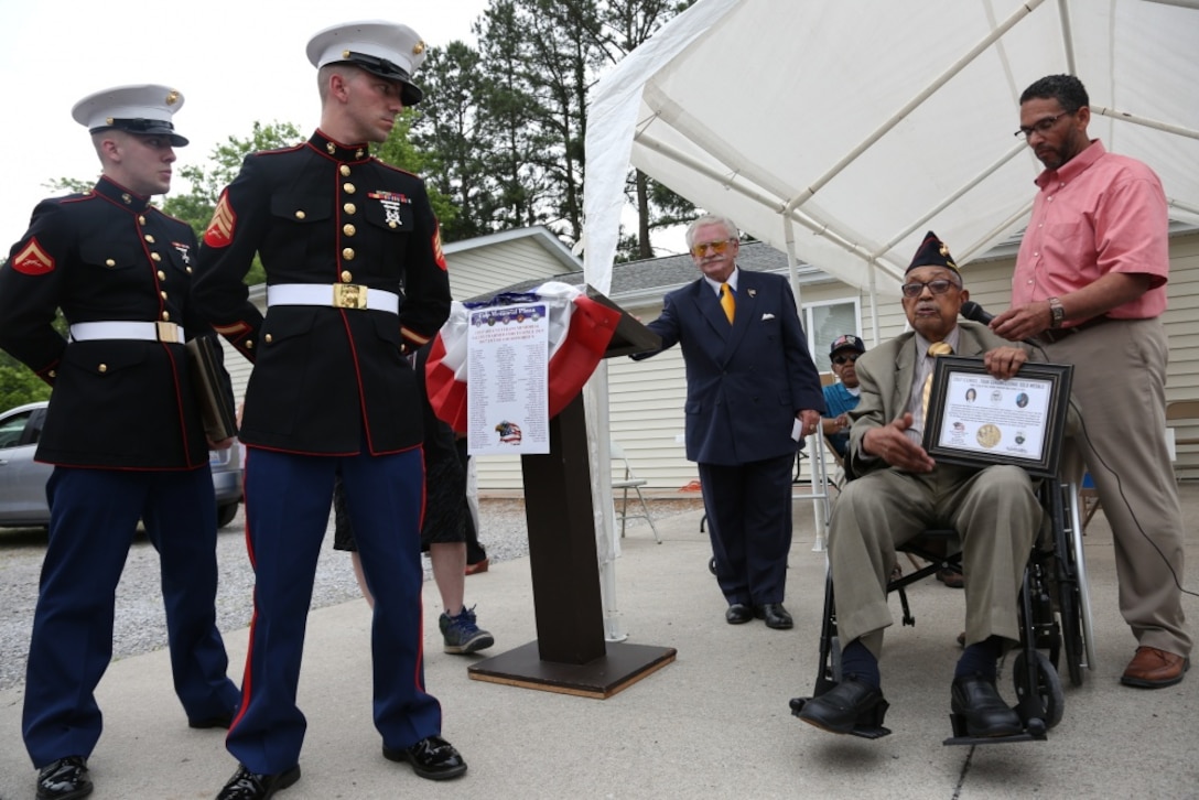 Two Marines with the 9th Marine Corps District, based out of Naval Station Great Lakes, Illinois, were on hand to honor four Montford Point Marines, May 27, at the Colp Area Veterans Celebration, Dedication and Remembrance Ceremony, in Colp, Illinois. Nearly 20,000 African-Americans joined the Marine Corps in 1942, after President Franklin D. Roosevelt issued a “presidential directive giving African Americans an opportunity to be recruited in the Marine Corps,” according to the Montford Point Marines Association website. They didn’t receive recruit training at San Diego or Parris Island, however, but Camp Montford Point, N.C., a segregated training site for African American Marine recruits. For the next seven years, the camp remained opened until it became desegregated. The four Marines are Sol Griffin, Jr.; James L. Kirby, Early Taylor, Jr. and Archibald Mosley. These Marines, among many other Montford Point Marines across the country, were awarded the Congressional Gold Medal, the highest award that can be given to a civilian by Congress, in 2012. (U.S. Marine Corps photo by Gunnery Sgt. Bryan A. Peterson)