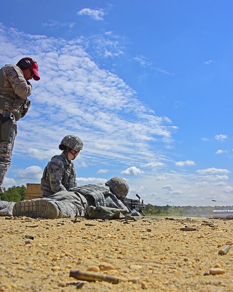 Tech. Sgt. Richard Bergante, Combat Arms Instructor, 166th Security Forces Squadron coaches two of his members on firing the M-240b machine gun during annual heavy weapons qualification at Joint Base Maguire-Dix-Lakehurst, N.J.,10 May 2017. (U.S. National Guard photo by SSgt. Andrew Horgan/released)