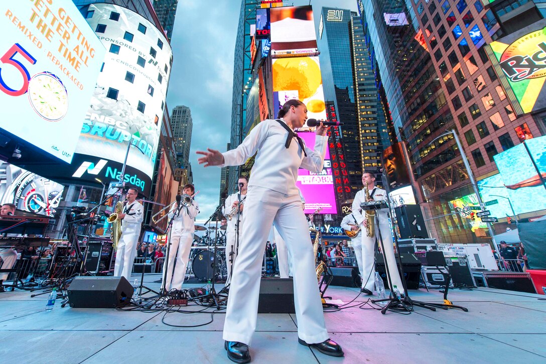 Navy Seaman Crissy Villalva sings during a free concert in Times Square as part of Fleet Week New York in New York City, May 26, 2017. Villalva is a musician assigned to the Navy Band Northeast’s Rhode Island Sound. Navy photo by Petty Officer 2nd Class Charles Oki