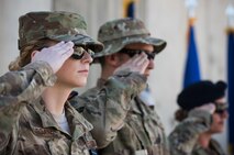 Airmen salute during the singing of the National Anthem at Bargram Airfield, Afghanistan, May 29, 2017. Bagram Airmen gathered to pay respect to fallen comrades during a Memorial Day ceremony. Memorial Day, observed on the last Monday of May, serves as a day for remembering service members who have died while serving. (U.S. Air Force photo by Staff Sgt. Benjamin Gonsier)