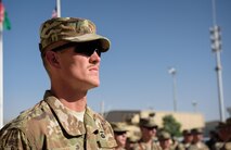 Chaplain (Capt.) Joshua Flynn listens during a portrayal of a fallen Airman during a Memorial Day ceremony at Bagram Airfield, Afghanistan, May 29, 2017. During the ceremony, Bagram Airmen portrayed three fallen comrades, telling the story of how they made the ultimate sacrifice. (U.S. Air Force photo by Staff Sgt. Benjamin Gonsier)