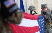 Tech. Sgt. Bajame Kirby, 455th Expeditionary Force Support Squadron, folds the American flag during a Memorial Day ceremony at Bagram Airfield, Afghanistan, May 29, 2017. Memorial Day, observed on the last Monday of May, serves as a day for remembering service members who have died while serving. (U.S. Air Force photo by Staff Sgt. Benjamin Gonsier)