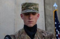 Staff Sgt. Aaron Anthony, 455th Expeditionary Communications Squadron, watches as he folds the American flag during a Memorial Day ceremony at Bagram Airfield, Afghanistan, May 29, 2017. Memorial Day, observed on the last Monday of May, serves as a day for remembering service members who have died while serving. (U.S. Air Force photo by Staff Sgt. Benjamin Gonsier)