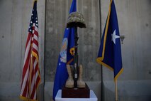 A Battlefield Cross is displayed during a Memorial Day ceremony at Bagram Airfield, Afghanistan, May 29, 2017. The boots, rifle and helmet make what is called the Battlefield Cross, which is a symbolic replacement of a cross and is used to honor and show respect to deceased service members. (U.S. Air Force photo by Staff Sgt. Benjamin Gonsier)
