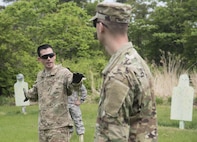U.S. Army Capt. Lee Schroeder, left, the Delta Detachment, 1st Space Company, Joint Tactic Army Ground Station commander, instructs Sgt. Kevin Stanewicz, right, a JTAGS engagement control team leader, during tactical training at Misawa Air Base, Japan, May 24, 2017. Each team member took turns playing different roles, such as team leaders and lookout positions, in combat formations so each member acquainted themselves with each role. (U.S. Air Force photo by Airman 1st Class Sadie Colbert)