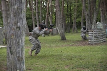 U.S. Army Staff Sgt. Wylie Nicholas, a Delta Detachment, 1st Space Company, Joint Tactic Army Ground Station engagement control team leader, provides cover for his teammates while they flank simulated enemy troops at Misawa Air Base, Japan, May 24, 2017. After many practices, Soldiers tested their strategy to secure the objective during a paintball round against opposing forces. (U.S. Air Force photo by Airman 1st Class Sadie Colbert)