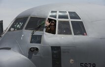 Col. Rebecca Sonkiss waves from a C-130J Super Hercules prior to her fini flight at Bagram Airfield, Afghanistan, May 16, 2017. Sonkiss served as the 455th Air Expeditionary Wing vice commander for the last 12 months. The fini flight is a time-honored military aviation tradition marking the last flight of a commander’s tour. (U.S. Air Force photo by Staff Sgt. Benjamin Gonsier)