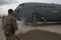 Chief Master Sgt. Peter Speen, the 455th Air Expeditionary Wing command chief, hoses down Col. Rebecca Sonkiss, the 455th AEW vice commander, at Bagram Airfield, Afghanistan, May 16, 2017. Sonkiss conducted her fini flight out of Bagram Airfield. The fini flight is a time-honored military aviation tradition marking the last flight of a commander’s tour. (U.S. Air Force photo by Staff Sgt. Benjamin Gonsier)