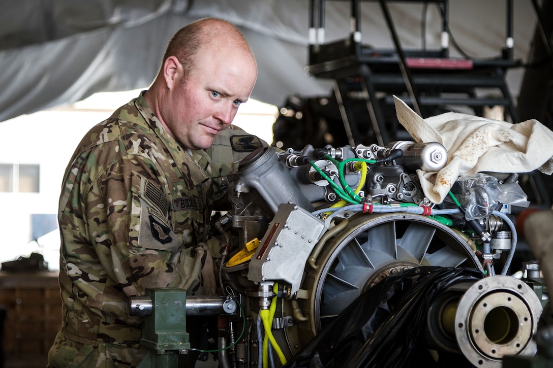 A soldier performs maintenance on an HH-60 Black Hawk helicopter engine at Bagram Airfield, Afghanistan, May 25, 2017. The soldier is assigned to 7th Infantry Division’s 16th Combat Aviation Brigade, Task Force Flying Dragons. The helicopter was going through phase maintenance, which is intensive maintenance that involves tearing down and rebuilding to ensure it remains safe and ready to support missions. Army photo by Capt. Brian Harris    