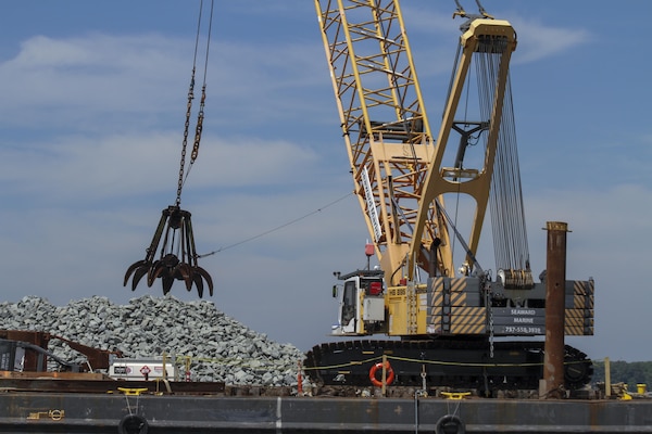 MATHEWS COUNTY, VA – Contractors use a crane to place granite along the bottom of the Piankatank River near Gwynn, Virginia.  The granite is being used to create 25 acres of new sanctuary reef habitat for oysters in the river.  (U.S. Army photo/Patrick Bloodgood)