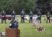 Tech. Sgt. Isaiah Martin, Dover Air Force Base Honor Guard NCO in charge, performs emcee duties at a Memorial Day commemoration May 29, 2017, at Sharon Hills Memorial Park in Dover, Del. The Dover AFB Honor Guard takes part in this commemoration ceremony annually. (U.S. Air Force photo by Senior Airman Zachary Cacicia)
