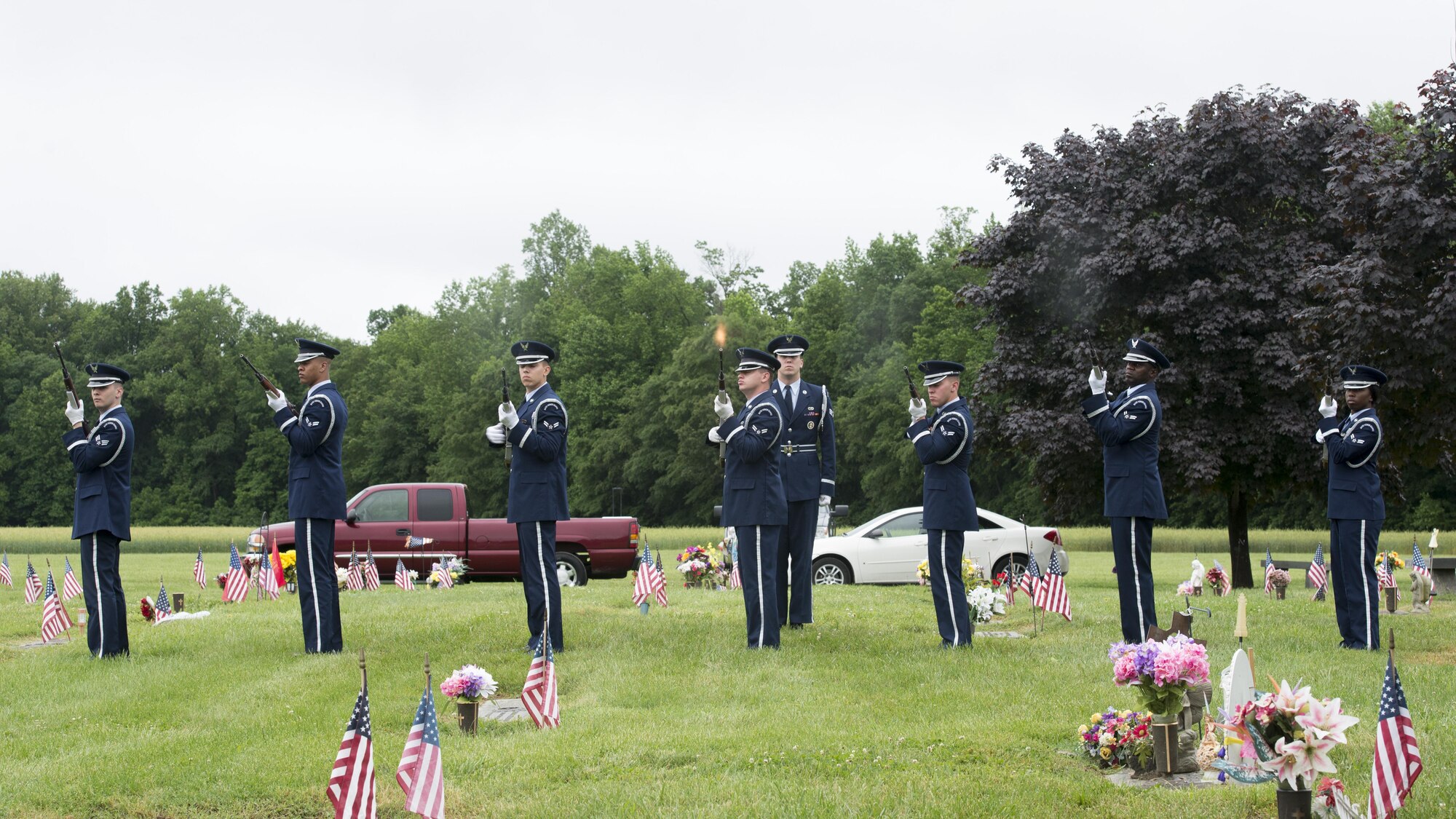 A Dover Air Force Base Honor Guard firing team fires a salute at a Memorial Day commemoration May 29, 2017, at Sharon Hills Memorial Park in Dover, Del. Memorial Day is a federal holiday for remembering service members who died while serving in the armed forces. (U.S. Air Force photo by Senior Airman Zachary Cacicia)