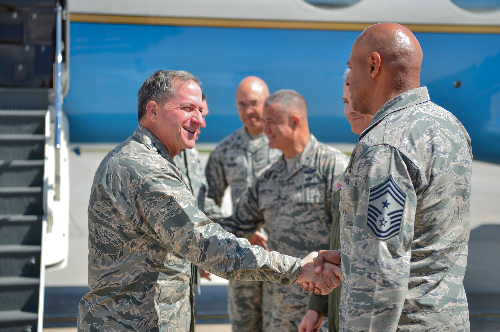 Chief Master Sgt. Rod Lindsey, 460th Space Wing command chief, greets Gen. David L. Goldfein, Chief of Staff of the U.S. Air Force, as he arrives May 25, 2017, on Buckley Air Force Base, Colo. During his visit, Goldfein walked through several static displays for a mission brief from the 140th Wing, met with space operators from the 460th Operations Group and toured the Aerospace Data Facility-Colorado. (U.S. Air Force photo by Airman 1st Class Holden S. Faul/ Released)