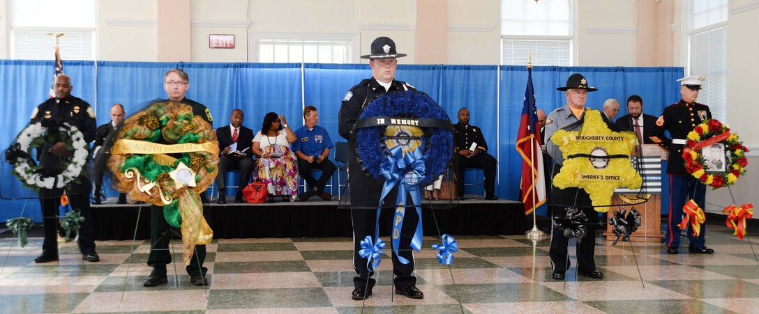 Uniformed officers from Albany and Dougherty County Police Departments, Dougherty County Sheriff’s Department as well as Marine Corps Logistics Base Albany’s Marine Corps Police Department participate in the city’s Law Enforcement Memorial Week Ceremony, recently. Albany State University’s L. Orene Hall was the site for the event, which is held annually to commemorate the sacrifices of police officers who died in the line of duty. 