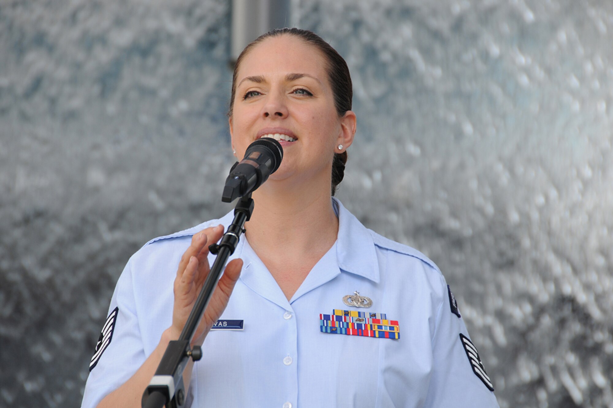 Tech. Sgt. Julia Cuevas, U.S. Air Force Band’s Celtic Aire founder and vocalist performs during a pre-game concert at SunTrust Park in Atlanta, Georgia May 20, 2017. As part of the Atlanta Braves’ Military Appreciation Day celebration, the band took the crowd on a folk and pop musical journey, opening with Paul Simon's "Cecelia" and encoring with a medley of the armed forces’ service songs. (U.S. Air Force photo/Airman 1st Class Justin Clayvon)