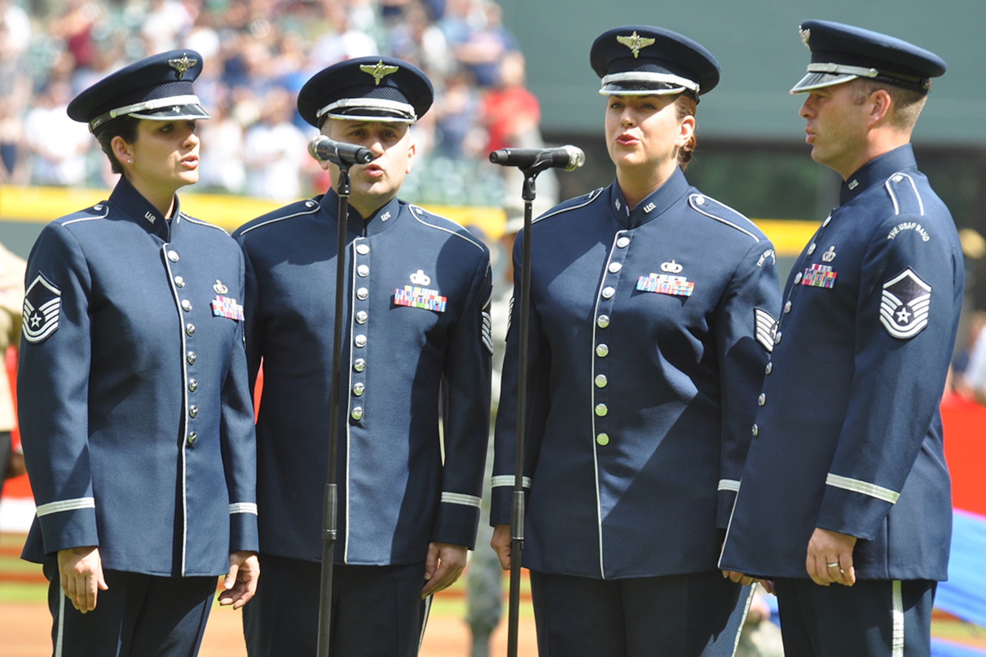Master Sgt. Emily Wellington, Master Sgt. Joseph Haughton, Tech. Sgt. Julia Cuevas and Master Sgt. Eric Sullivan Jr. from the U.S. Air Force Band’s Celtic Aire perform the National Anthem at SunTrust Park in Atlanta, Georgia May 20, 2017. The accapella rendition was accompanied by an F-16 flyover of the nearly full 41,149 seat stadium. (U.S. Air Force photo/Master Sgt. James Branch)