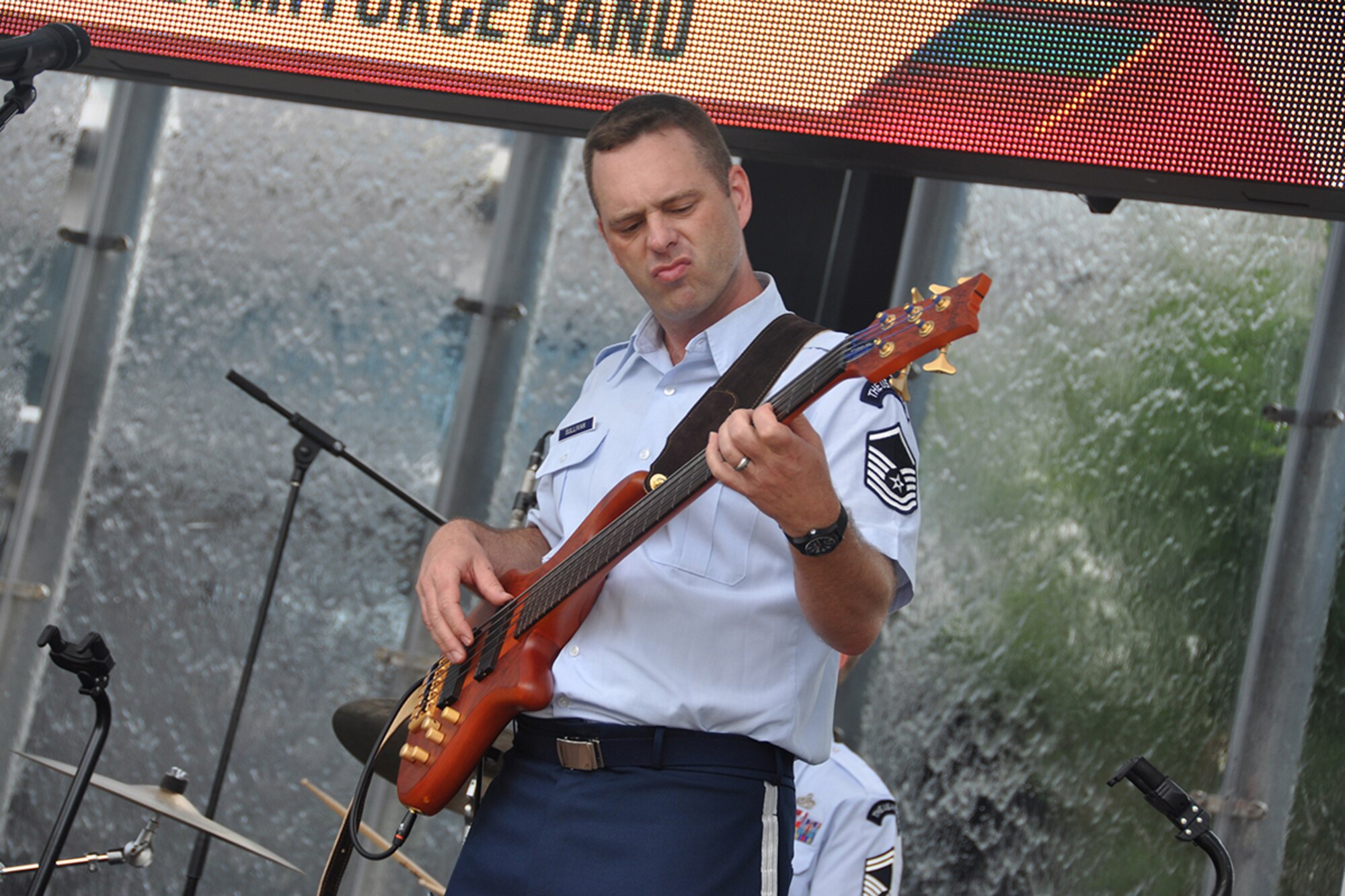 Master Sgt. Eric Sullivan, Jr., U.S. Air Force Band’s Celtic Aire vocalist and bassist, performs a pre-game concert at SunTrust Park in Atlanta, Georgia May 20, 2017. As part of the Atlanta Braves’ Military Appreciation Day celebration, the band took the crowd on a folk and pop musical journey, opening with Paul Simon's "Cecelia" and encoring with a medley of the armed forces’ service songs. (U.S. Air Force photo/Master Sgt. James Branch)