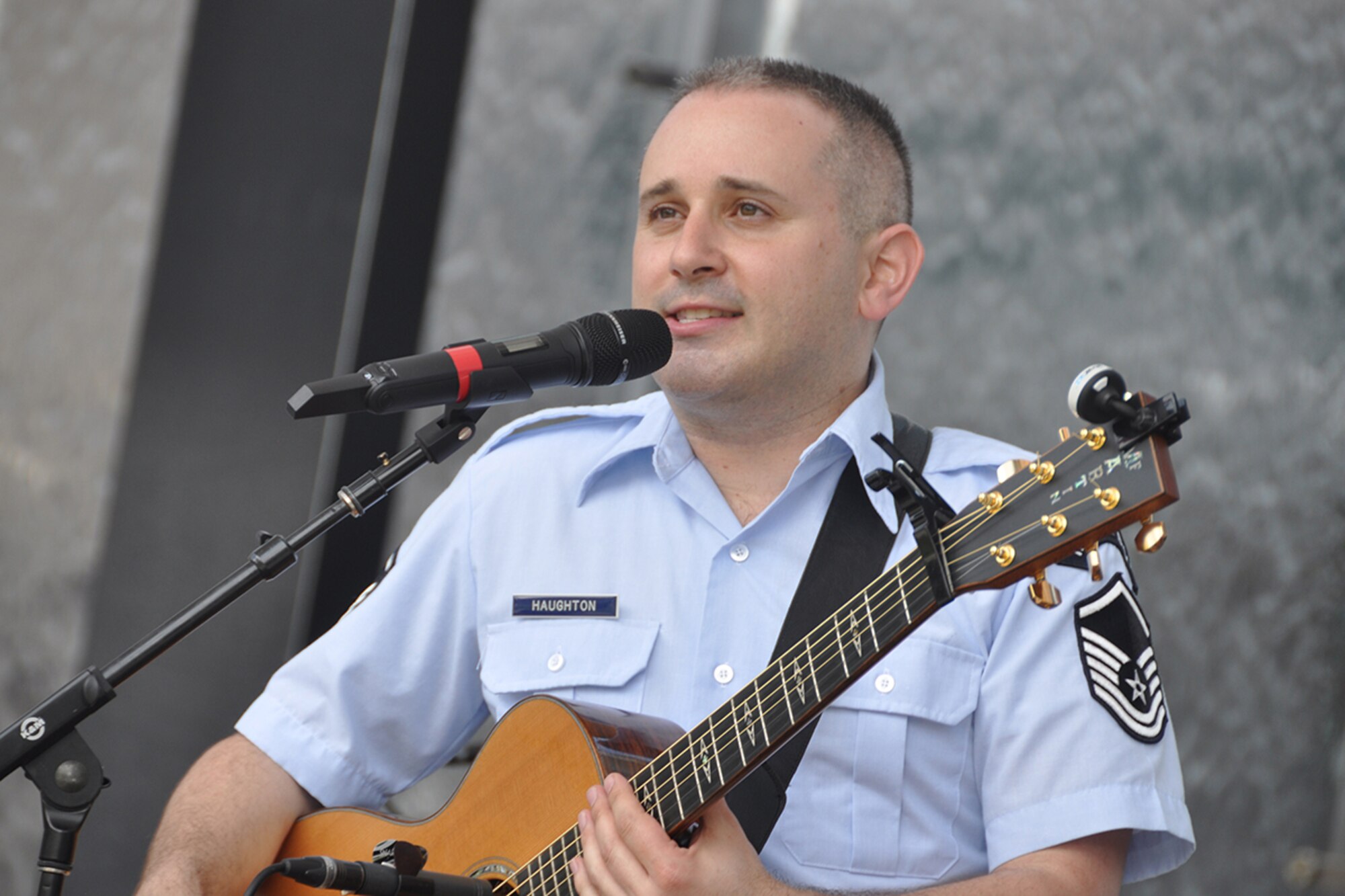 Master Sgt. Joseph Haughton, U.S. Air Force Band’s Celtic Aire vocalist and guitarist, performs during a pre-game concert at SunTrust Park in Atlanta, Georgia May 20, 2017. As part of the Atlanta Braves’ Military Appreciation Day celebration, the band took the crowd on a folk and pop musical journey, opening with Paul Simon's "Cecelia" and encoring with a medley of the armed forces’ service songs. (U.S. Air Force photo/Master Sgt. James Branch)