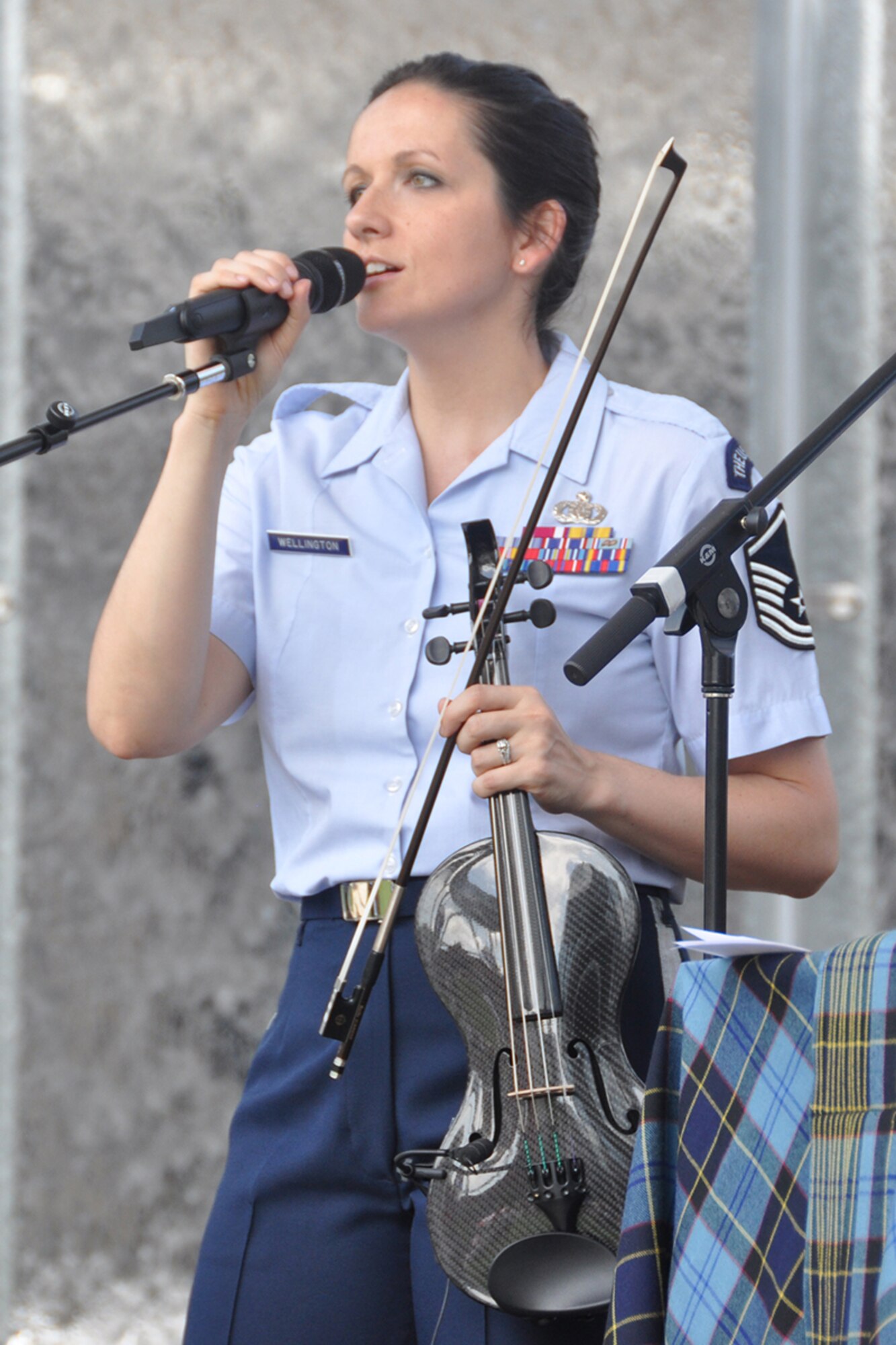 Master Sgt. Emily Wellington, U.S. Air Force Band’s Celtic Aire vocalist and violinist, performs during a pre-game concert at SunTrust Park in Atlanta, Georgia May 20, 2017. As part of the Atlanta Braves’ Military Appreciation Day celebration, the band took the crowd on a folk and pop musical journey, opening with Paul Simon's "Cecelia" and encoring with a medley of the armed forces’ service songs. (U.S. Air Force photo/Master Sgt. James Branch)