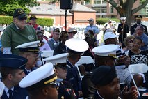 U.S. Armed Forces World War II veterans stand during a roll call of veterans who have served in conflicts around the globe during a Memorial Day Wreath Laying Ceremony at the Hampton National Cemetery in Hampton, Va., May 29, 2017. More than 130 ceremonies across the nation hosted Memorial Day ceremonies this year, including Arlington National Cemetery in Arlington, Virginia, where President Donald Trump laid a wreath on the Tomb of the Unknown Soldier. (U.S. Air Force photo/Staff Sgt. Teresa J. Cleveland)