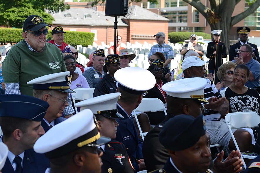 U.S. Armed Forces World War II veterans stand during a roll call of veterans who have served in conflicts around the globe during a Memorial Day Wreath Laying Ceremony at the Hampton National Cemetery in Hampton, Va., May 29, 2017. More than 130 ceremonies across the nation hosted Memorial Day ceremonies this year, including Arlington National Cemetery in Arlington, Virginia, where President Donald Trump laid a wreath on the Tomb of the Unknown Soldier. (U.S. Air Force photo/Staff Sgt. Teresa J. Cleveland)