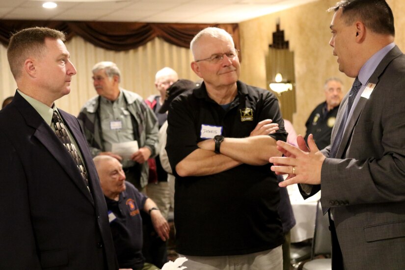 Don Montgomery, division logistics chief for the 98th Training Division (Initial Entry Training), and Maj. Gen. (Ret.) Dennis E. Lutz, listen to Charles Fairbanks, command executive officer for the 108th Training Command (Initial Entry Training), during a 98th Alumni Luncheon on April 20, 2017 in Rochester, New York. The 98th Training Division is headquartered in Fort Benning, Georgia but was originally formed in New York. (U.S. Army Reserve photo by Maj. Michelle Lunato/released)
