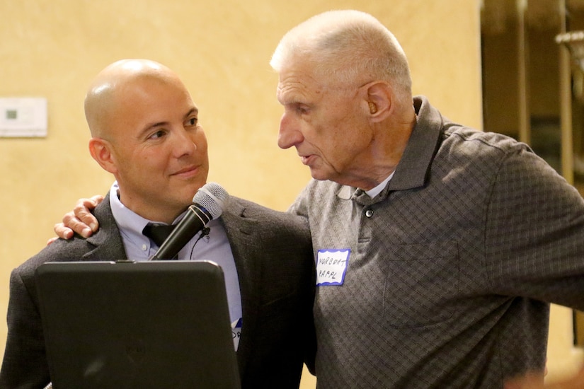 Danny Molina, chief executive officer, 98th Training Division (Initial Entry Training), listens to Maj. Gen. (Ret.) Norbert Rappl, former commanding general of the 98th Training Division (IET), during the 98th Alumni Luncheon in Rochester, New York on April 20, 2017. (U.S. Army Reserve photo by Maj. Michelle Lunato/Released)