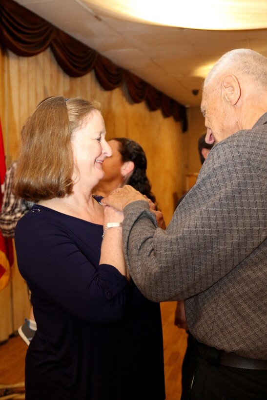 Sgt. Maj. (Ret.) Jane Decker, the last division personnel sergeant major, receives her Legion of Merit from Maj. Gen. (Ret.) Norbert Rappl, a former commanding general for the 98th Training Division (Initial Entry Training), during the 98th Alumni Luncheon on April 20, 2017 in Rochester, New York. Decker, an Army Reserve Soldier from Spencerport, New York, started her military service in the Women's Army Corps. (U.S. Army Reserve photo by Maj. Michelle Lunato/Released)