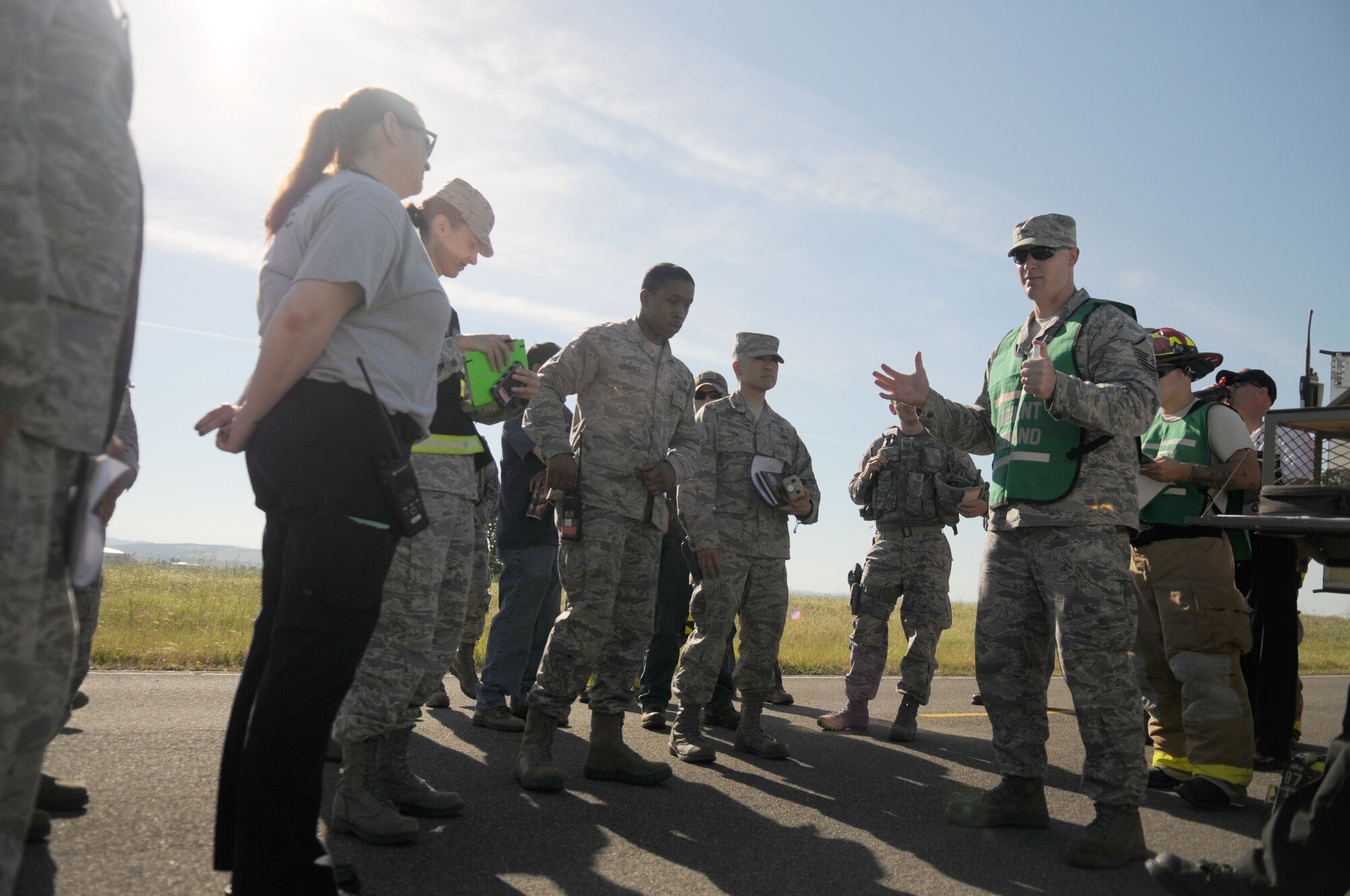 Airman assigned to Beale Air Force Base gather for a brief prior to a fuel spill exercise designed to see how well they respond at Beale AFB, California May 4, 2017. Exercises are designed and implemented by wing inspector generals, ensuring that Airmen are proficient in the skills needed for that scenario. (U.S. Air Force photo by Airman 1st Class Douglas Lorance)