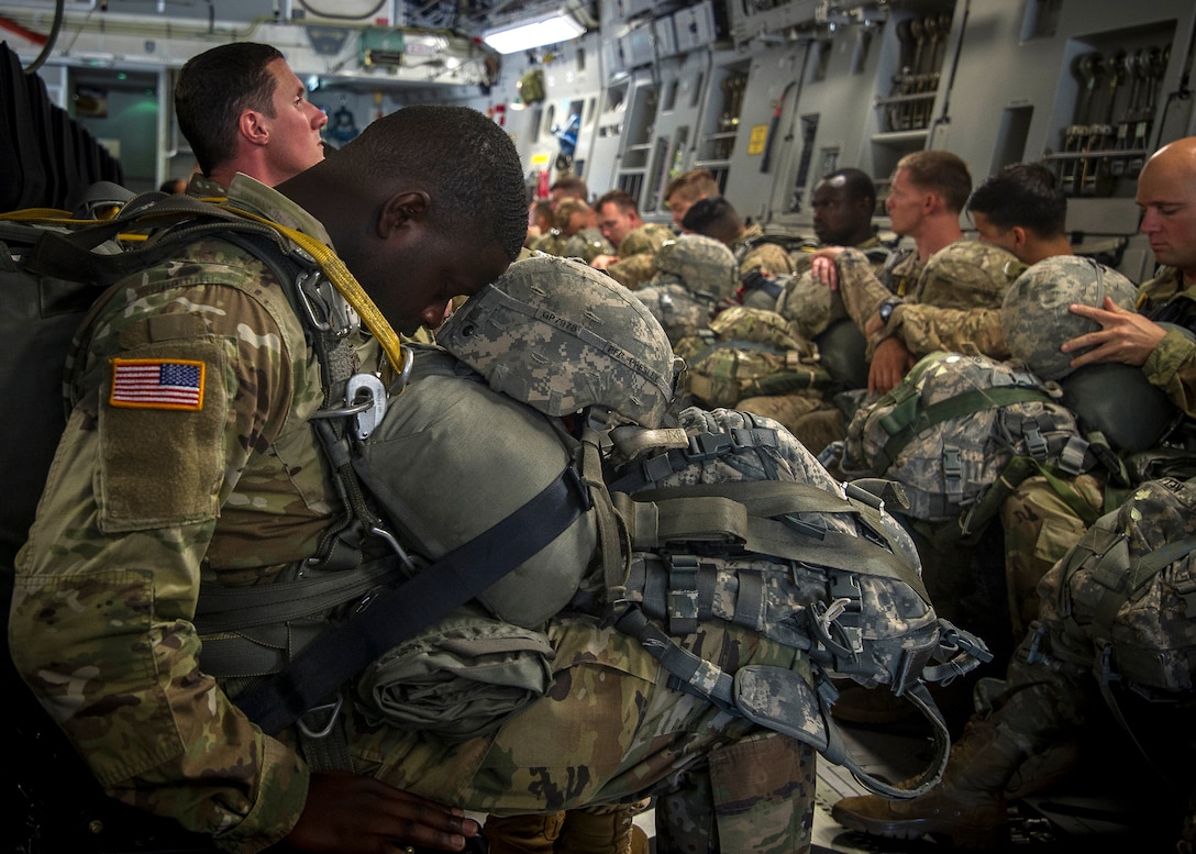 Sometime paratroopers have to take cat naps when they can, like during a flight to their drop zone.  Aircrews from the 315th and 437th Airlift Wings took off,  May 25, from Joint Base Charleston in 18 C-17 Globemaster IIIs within seconds of each other as part of a large formation exercise over Carolina skies.
Exercise Bonny Jack was a joint service exercise with about 1,600 paratroopers from the 82nd Airborne Division at Fort Bragg.  (U.S. Air Force Photo / Tech. Sgt. Bobby Pilch)
