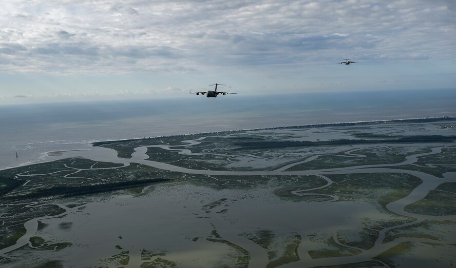 Aircrews from the 315th and 437th Airlift Wings took off,  May 25, from Joint Base Charleston in 18 C-17 Globemaster IIIs within seconds of each other as part of a large formation exercise over Carolina skies. Exercise Bonny Jack was a joint service exercise with about 1,600 paratroopers from the 82nd Airborne Division at Fort Bragg.  (U.S. Air Force Photo / Master Sgt. Shane Ellis)
